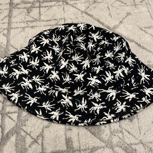 black buckethat with demons/devils